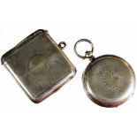 An early 20thC pocket watch case, engine turned with a vacant shield cartouche and plain ring top,