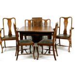 An early Edwardian oak dining room suite, comprising table with canted top on square tapering legs