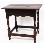 A 17thC oak side table, with moulded over hand top, frieze drawer, baluster turned legs and square