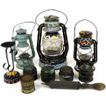 Various decorative Tilly lamps, to include one painted with repeating pattern of flowers and