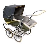 A vintage Montford pram, with adjustable canopy in light blue and a green and cream metal base