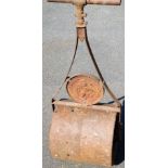 A late 19thC heavy garden roller, with turned handle and shaped centre section, 106cm high.