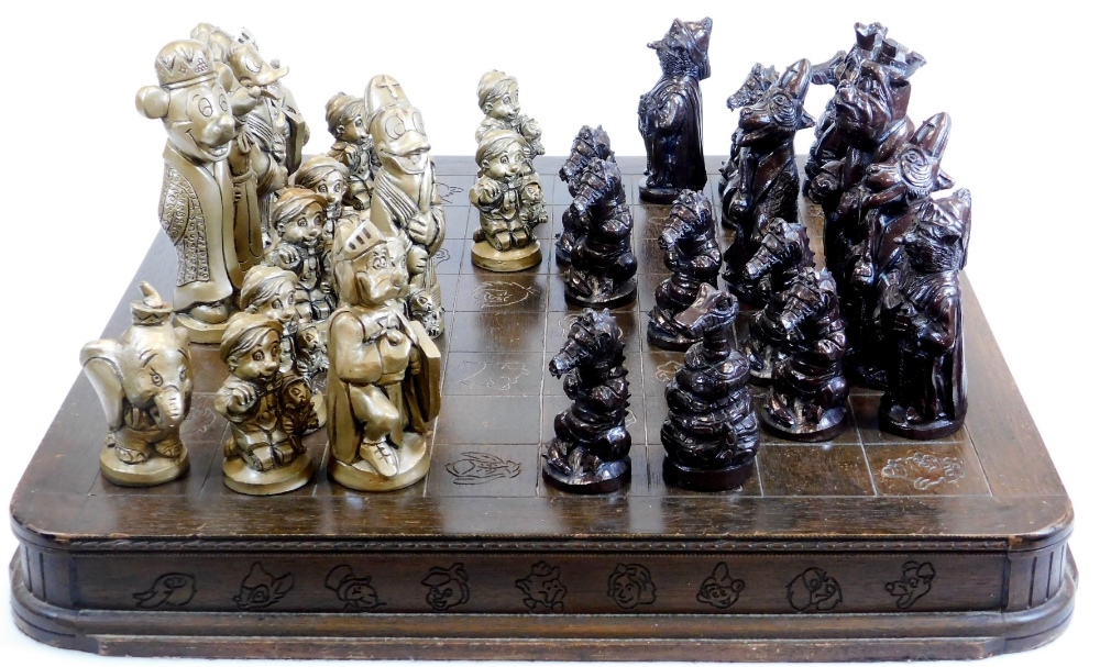 Disney interest, a hardwood chess set, of oblong form, with etched squares set with various Disney
