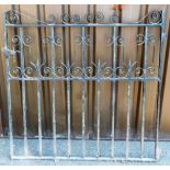 A 20thC wrought iron gate, with vertical bars broken by shaped sections, 122cm wide.