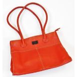 An Osprey London handbag, in red with visible stitching, 24cm wide.