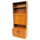 A vintage G Plan bookcase, with open shelves raised above double cupboard beneath, 214cm high,