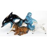 A Beswick foal, number 915, recumbent, 13cm wide, a grey foal, Poole dolphin and an otter, marked