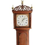 J Bright Saxmundham. A 19thC oak country longcase clock, the shaped cornice surmounted by a brass