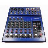A Yamaha MG10/2 mixing console, blue and black colour way, 25cm wide.
