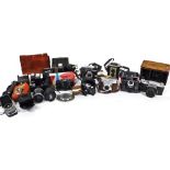 Various cameras, a Voightlander Veitob, 13cm high, in brown leather case, a Paxette 35 auto in