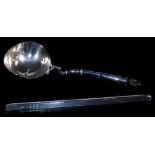 A George III silver spoon, with wide oval bowl and turned handle initialled RG, London probably