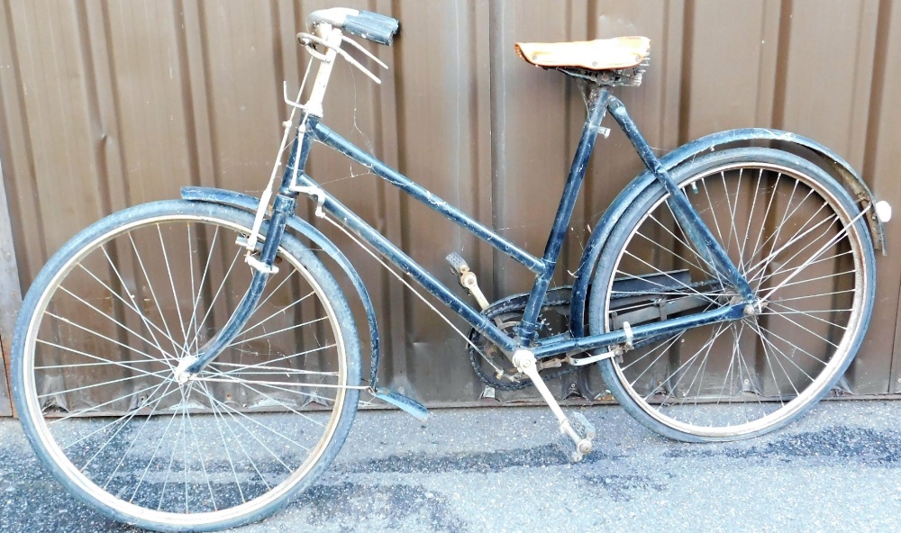 A vintage metal framed ladies bike, in black trim.