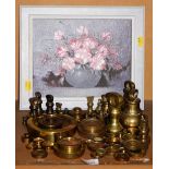Various brass weights, and a still life picture vase of flowers.