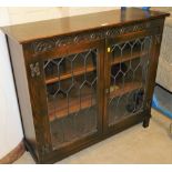 An oak two door astragal glazed low bookcase.