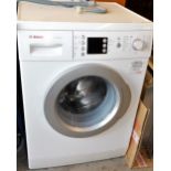 A Bosch Varioperfect washing machine, in white trim, 88cm high, 58cm wide, 53cm deep.