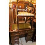 A late 20thC twin pedestal writing desk, of small proportion, with single tooled green leatherette