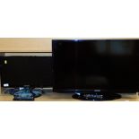 A Samsung 31 inch colour TV, with remote control and wire in black trim, and a Samsung KDTV 18