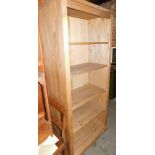 A pine open bookcase, of rectangular form.