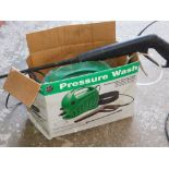 A pressure washer, partially boxed.