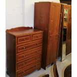 A bedroom suite, comprising double door wardrobe and a compactum chest of two short and four long