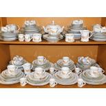 A comprehensive Apilco French pottery dinner service, made for Perrier Jouet Champagne, each piece