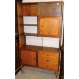 A retro teak display cabinet, with glazed doors above cupboard and open shelves above further