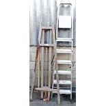 A folding easel, folding step ladder, grip and hoe. (a quantity)