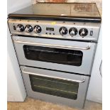 A New World New Home gas and electric cooker, in grey and black trim, 93cm high, 59cm wide, 60cm