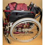 A folding wheelchair.