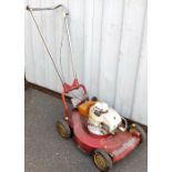 A Mountfield rotary mower, in red colour way.