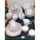 Decorative tea ware, a part service decorated with flowers of pink highlights and another part