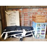 Various items, folding exercise bike, wicker hamper, boxed trolley, boxed barbecue, etc. (a