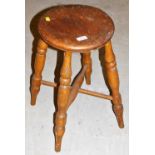 A 19thC ash and elm Boston style stool, with circular top.