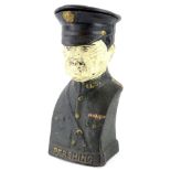 A cast iron money box, modelled in the form of General Pershing, 19.5cm high.