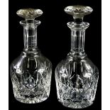 A pair of late 20th/early 21stC cut glass decanters, each with a facet cut stopper, 26cm high.