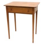 An early 20thC oak Arts & Crafts style side table, the rectangular top with cleated ends, above a fr