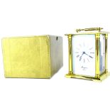 A Rapport brass carriage clock, the white enamel type dial with Roman numerals, in presentation box,