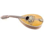An early 20thC Neapolitan mandolin, teardrop form inlaid in mother of pearl, with butterflies, flowe