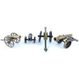A collection of four miniature brass cannon, to include one to commemorate the Battle of Waterloo et