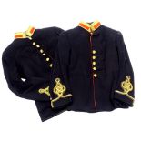 A pair of 1891 Royal Artillery Officers tunics, in navy with gold and red piping.