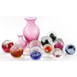 A collection of Caithness and other paperweights, two coloured glass vases, etc.