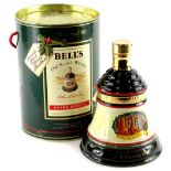 A bottle of Bells Christmas 1991 extra special whisky, in a bell shaped decanter, boxed.