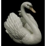 A Lladro porcelain figure of a swan, numbered 5231, 18cm high.