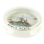 A Shelley ceramic baby's plate, printed and hand painted to the interior with a naval war ship, aero