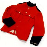 A Queen Victoria Boy's School child's scarlet tunic, circa 1950.