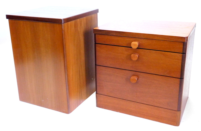 A Stag teak bedside cabinet, with three drawers, shaped handles, on a plinth base, 55cm high, 56cm d