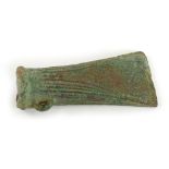 A Bronze Age bronze socket axe head, with reeded decoration to the sides, loop, etc. 10cm long. Pro