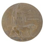 A First World War bronze death penny or plaque, for a James Taylor, 12cm diameter.