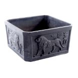 An early 20thC Davidson black satin relief moulded bowl, decorated with the Tutankhamun pattern, of