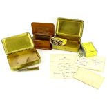 A First World War brass Christmas 1914 box, with original contents of cigarettes and tobacco, a prin